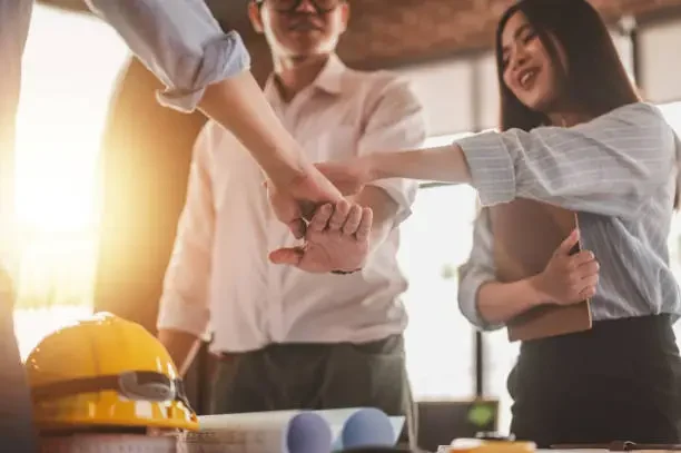 Three people agree with each other after a meeting