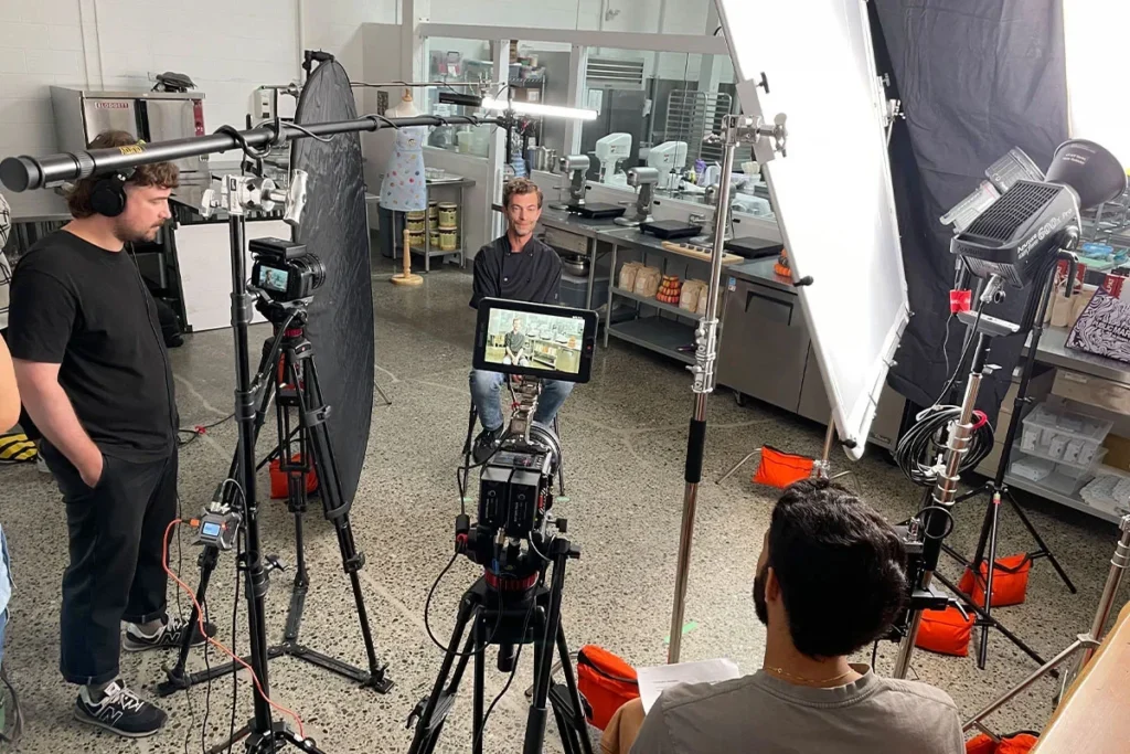 people discussing before filming