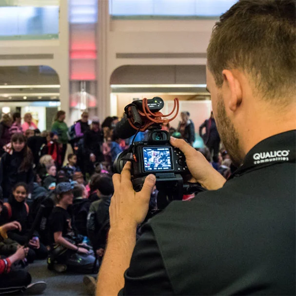 A multi-camera video production setup at a corporate event in Calgary, ensuring comprehensive coverage of speakers and audience.