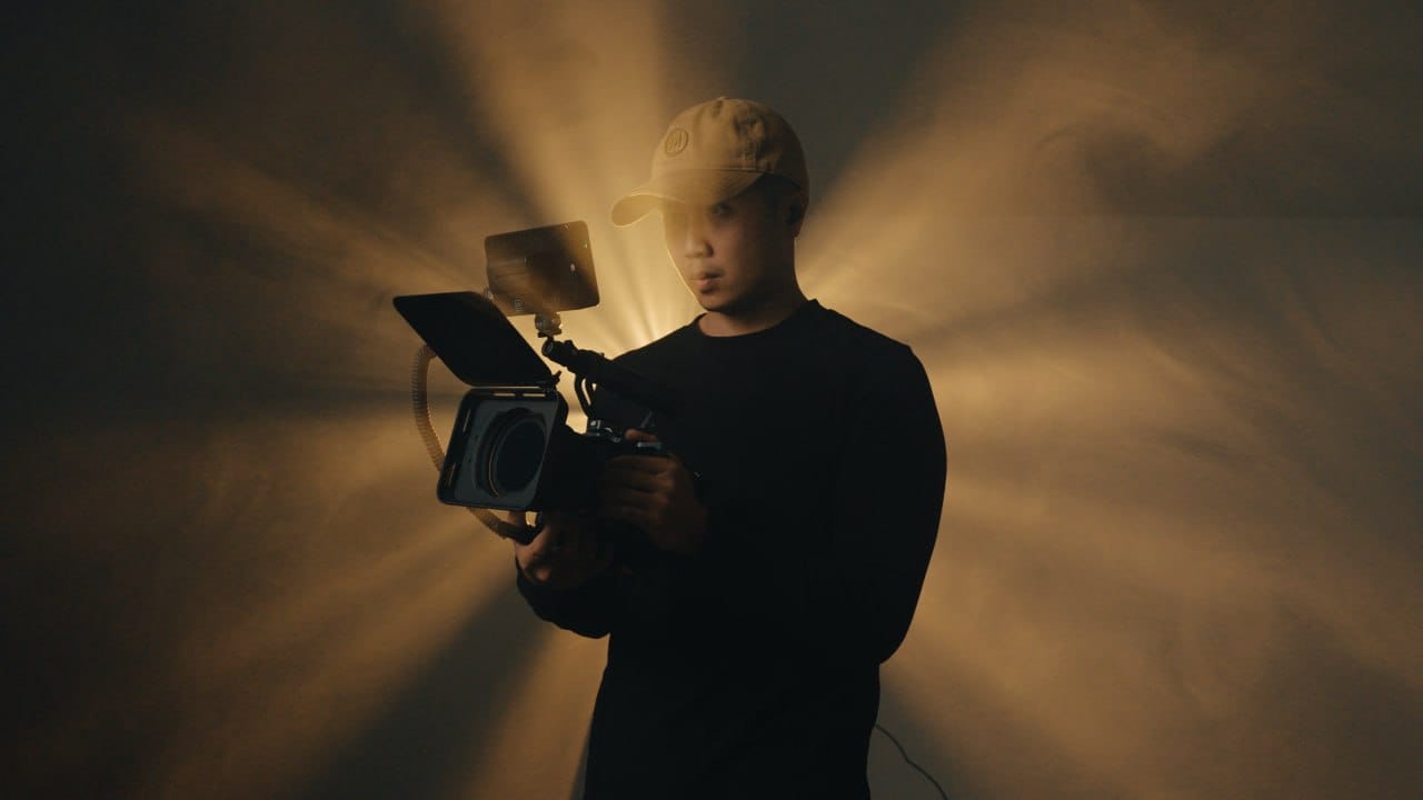 Jared Ho filming with a cinema camera