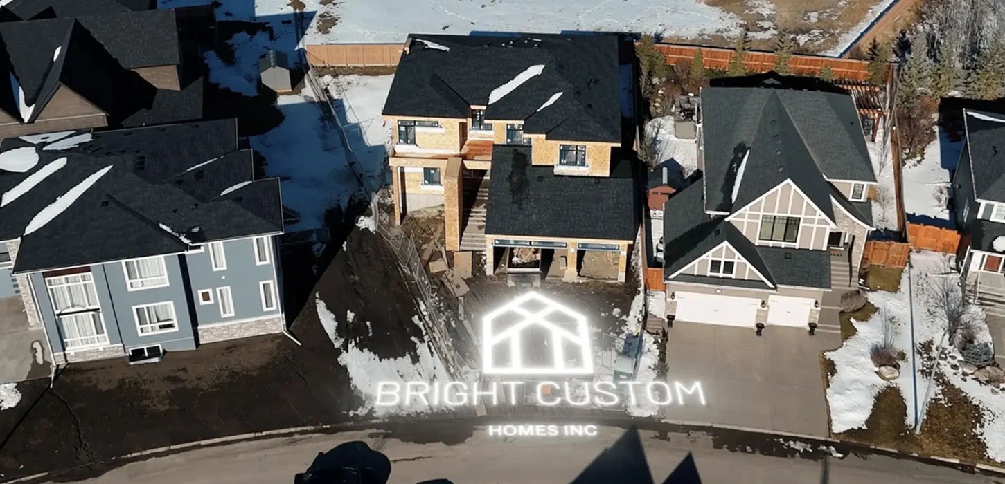 Bright Home builder walking through a framed house