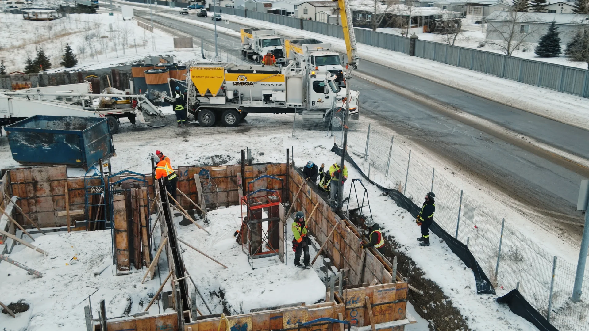 Omega2000 cribbing crew placing concrete in Calgary
