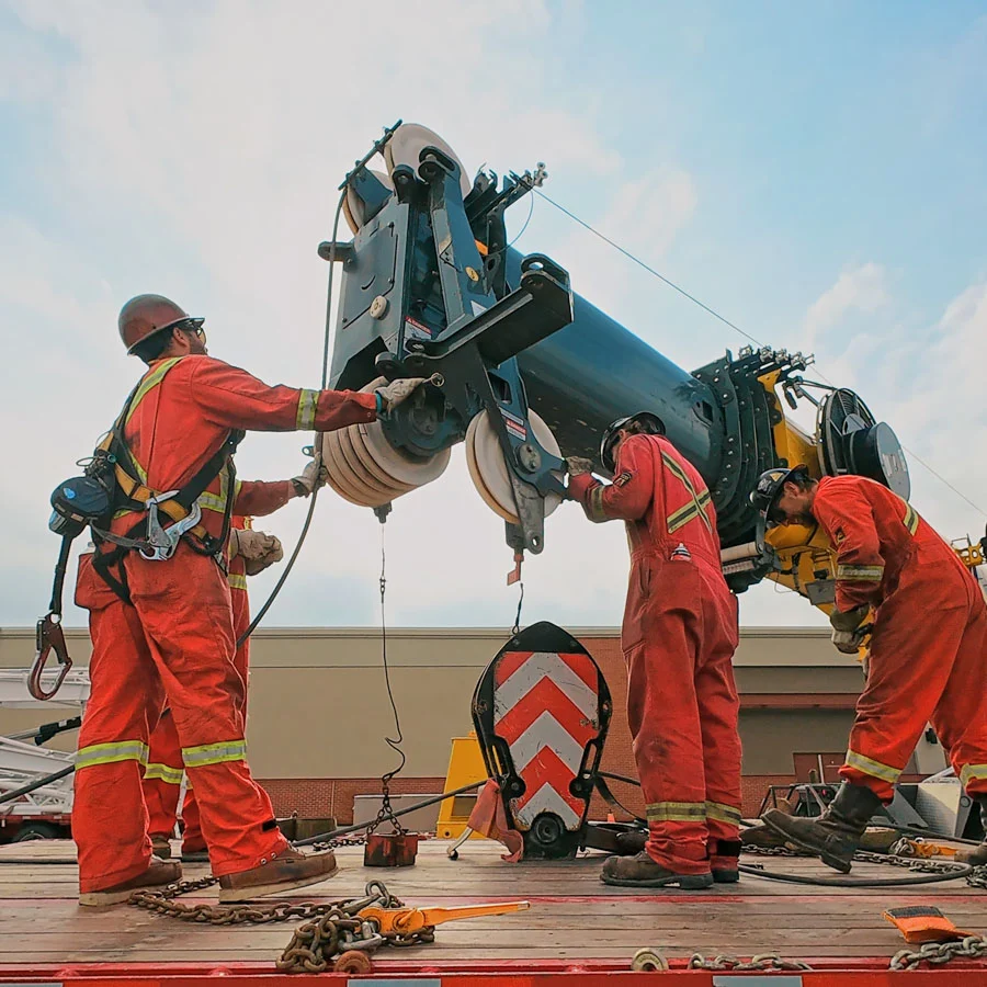 Ground crew signalling the crane operator