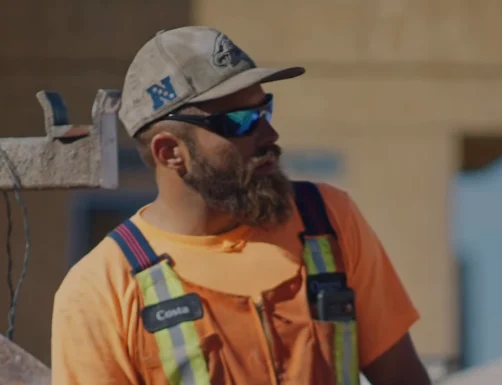 Construction superintendent filmed for an employee testimonial video on an active Calgary job site